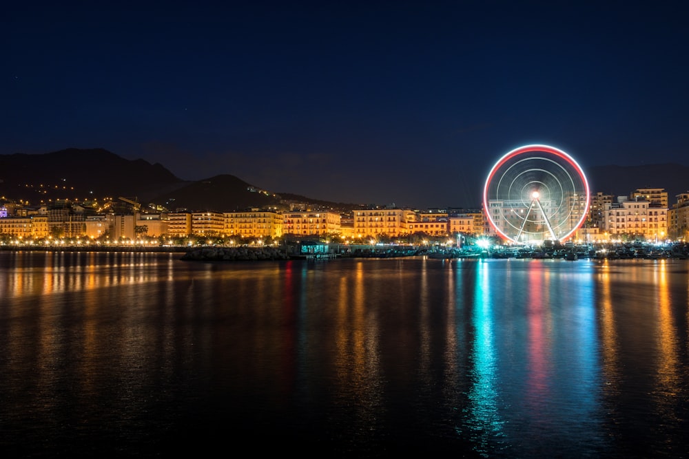 time-lapse photography of London Eye during night time