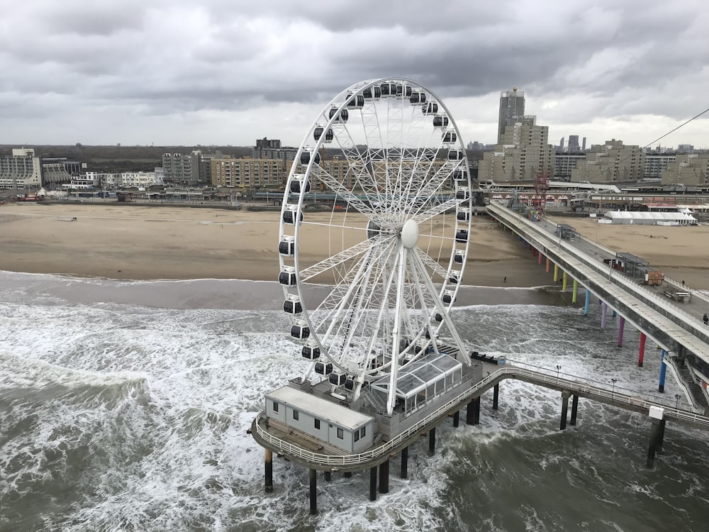 Ferris wheel on structure near beach