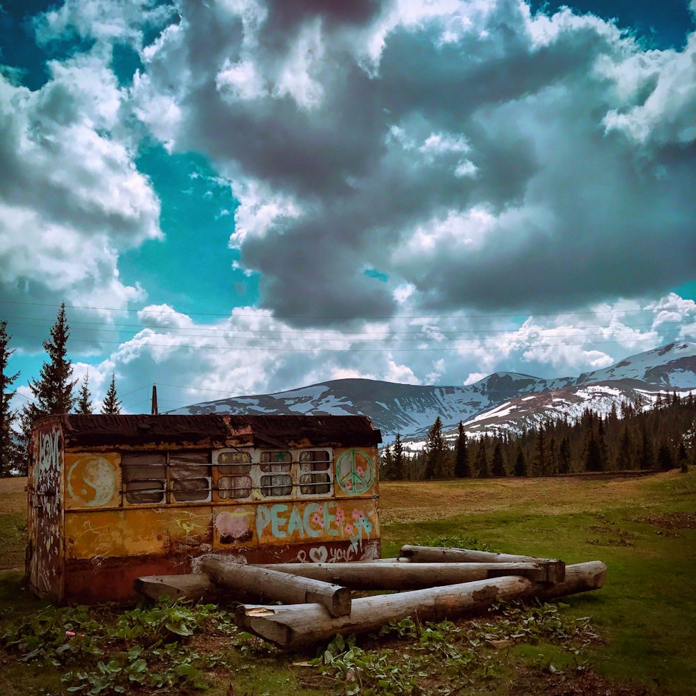 orange and red shed under white clouds