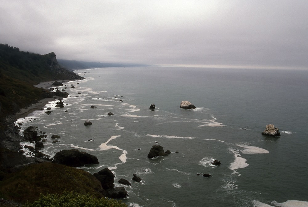 coastal rocks under gray skies