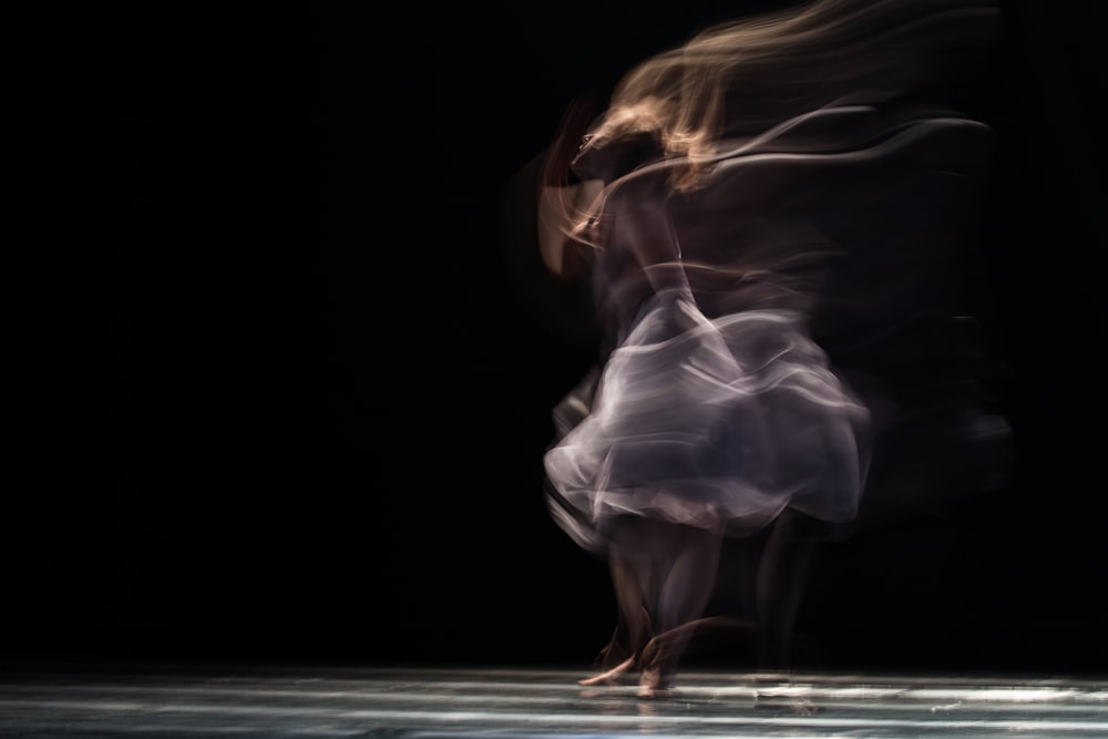 dancing woman on concrete pavement