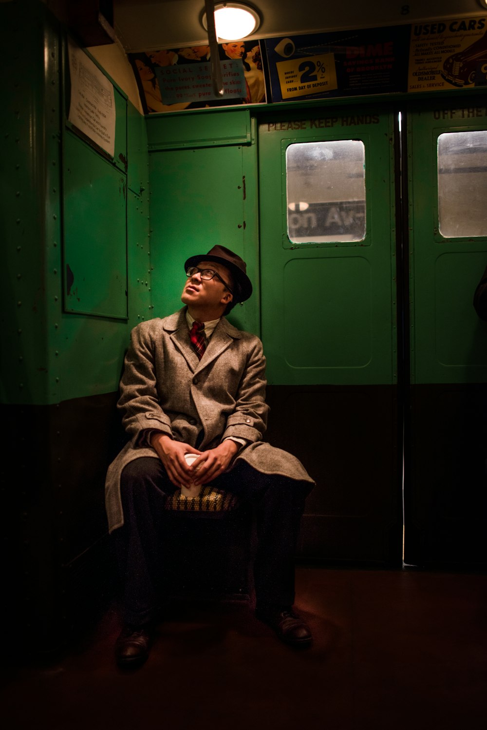 person sitting inside train