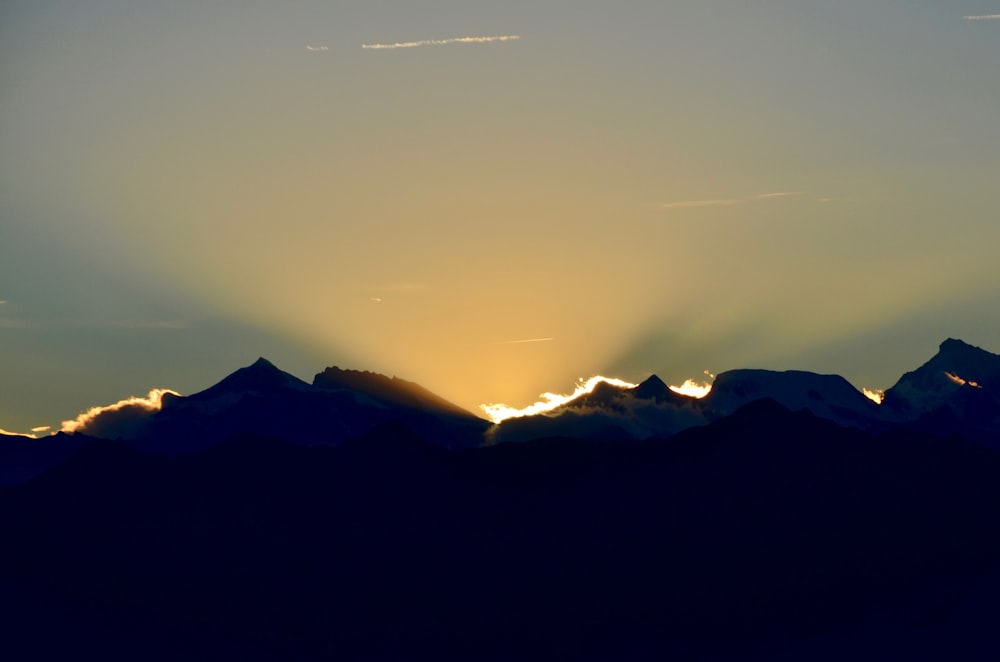 silhouette of mountains during daytime