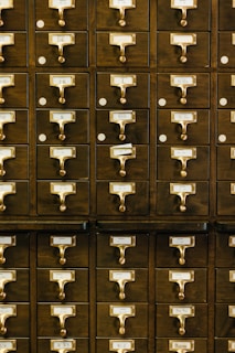 close-up photography of brown wooden card catalog