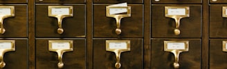 close-up photography of brown wooden card catalog