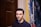 man standing beside door