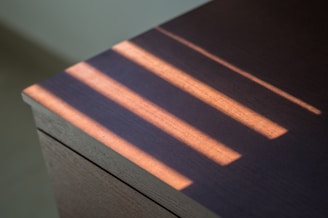 A resin-filled wooden table catching the warm afternoon light.