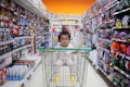 baby on white shopping cart
