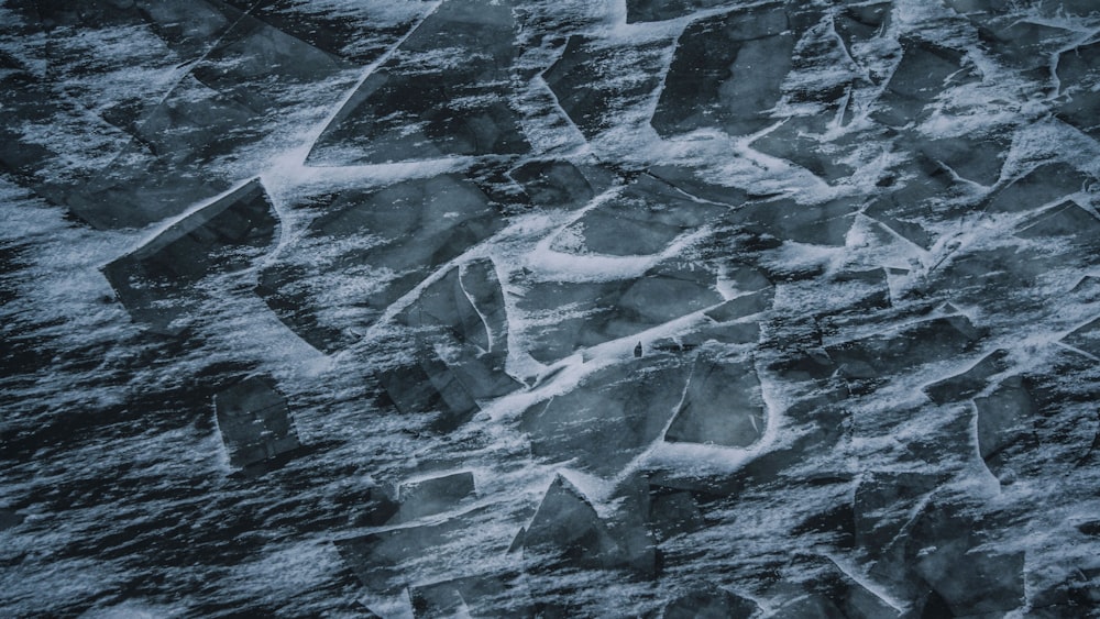 a close up of a bunch of rocks in the snow