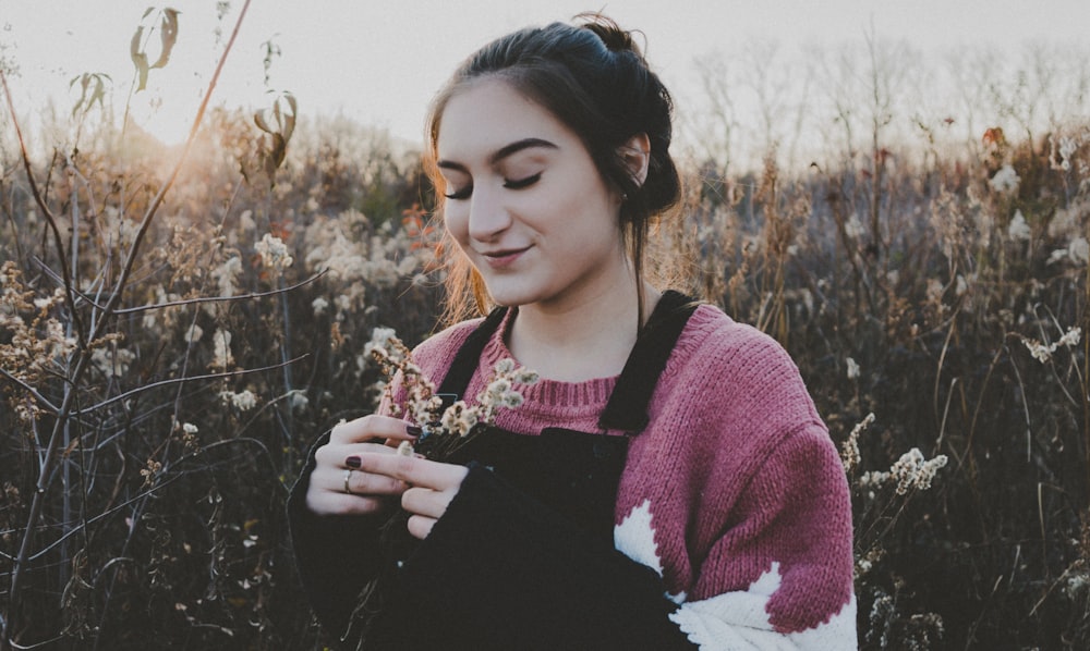 smiling woman holding flowers