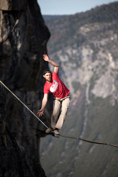 man waking on rope
