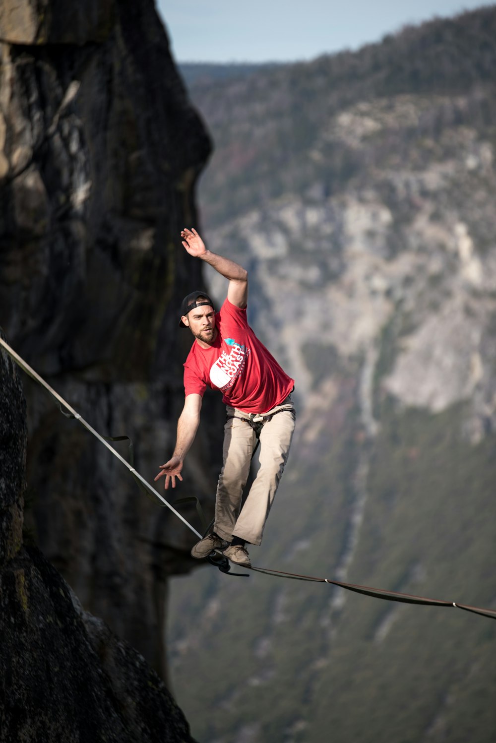 man waking on rope