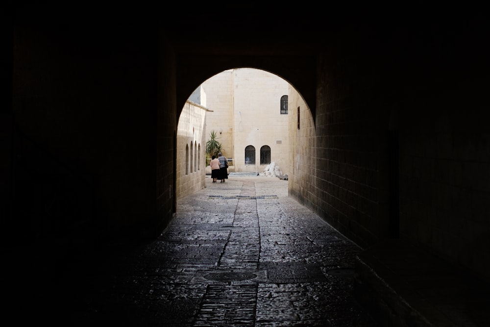 black concrete pathway between buildings