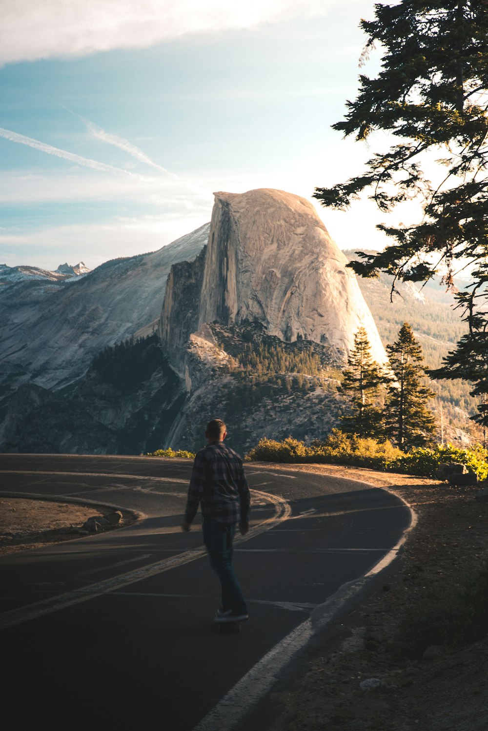 man playing skateboard on road