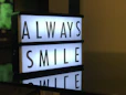 turned on Always Smile LED signage