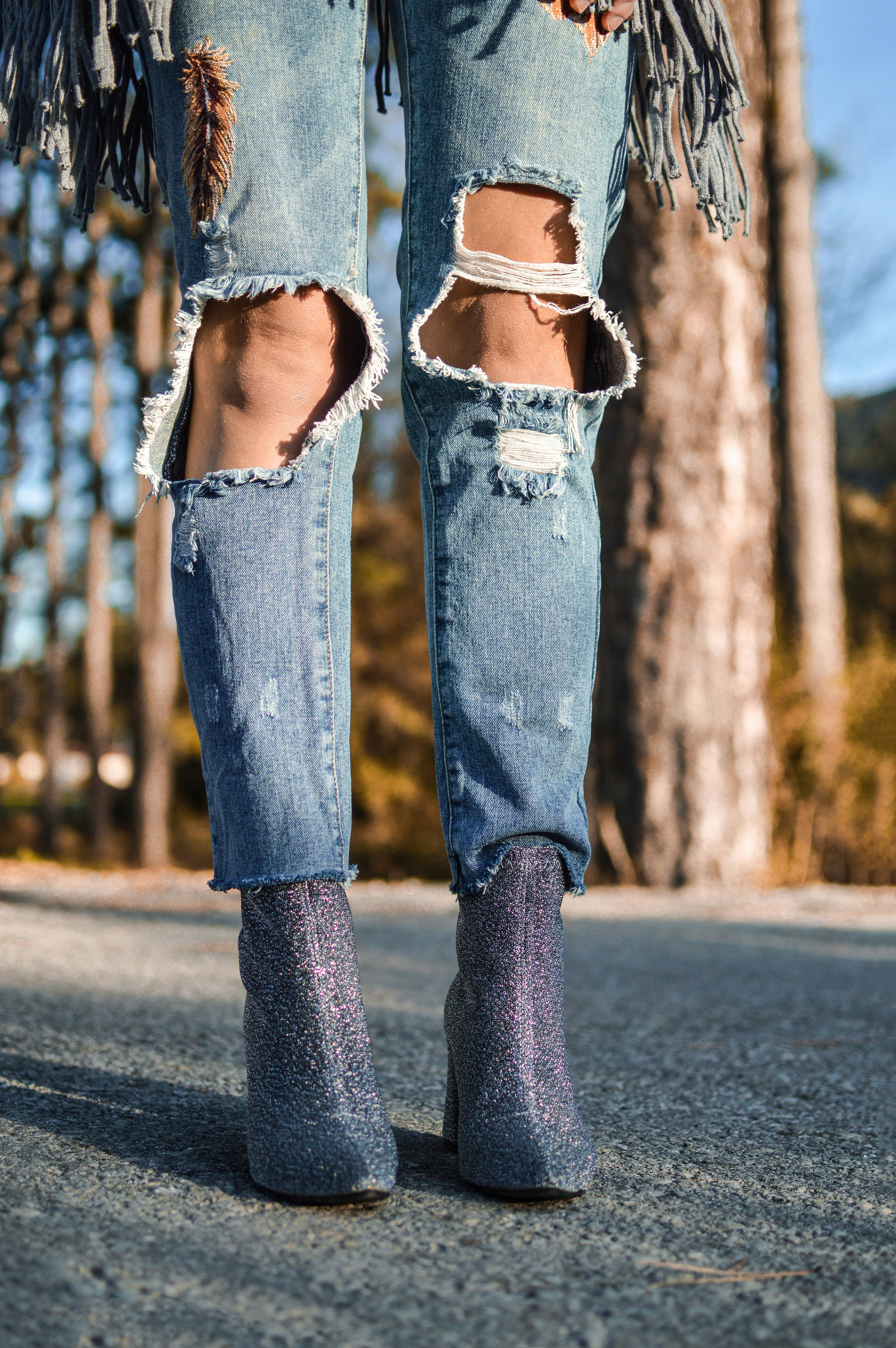 Women's Torn Jeans with Two Knees Showing