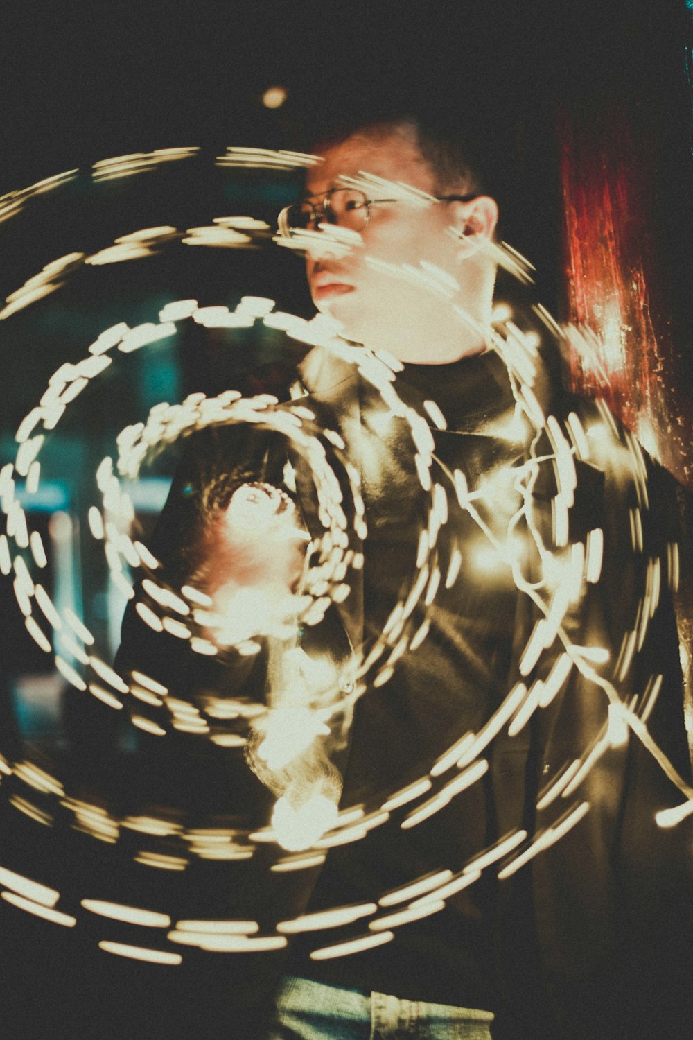 time lapse photography of man holding sparkler