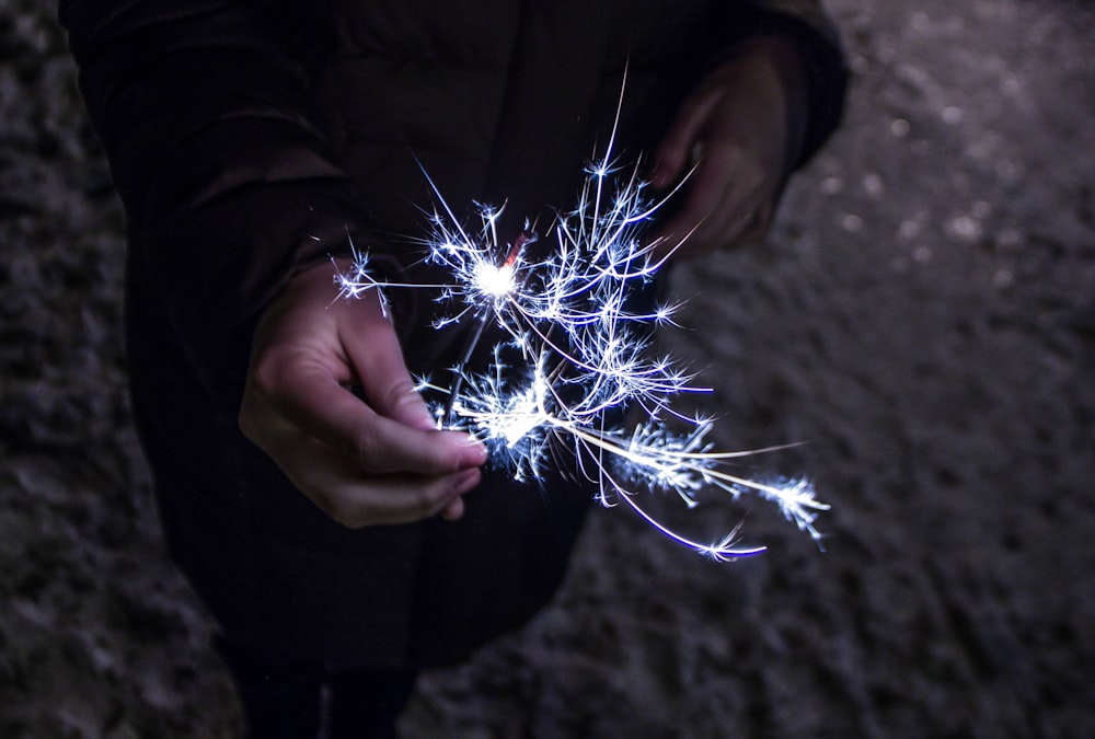 person holding sparkler