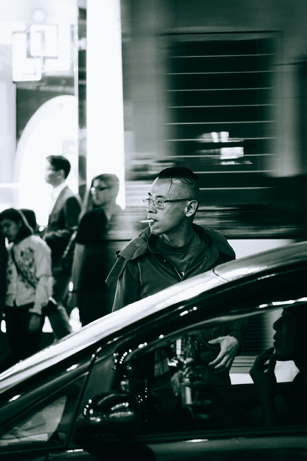 man smoking near car