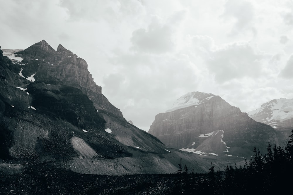 snow-covered mountains during cloudy day