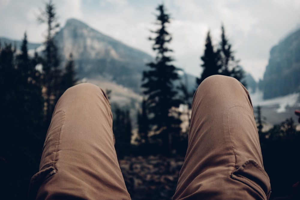 selective focus photography of person wearing brown cargo pants