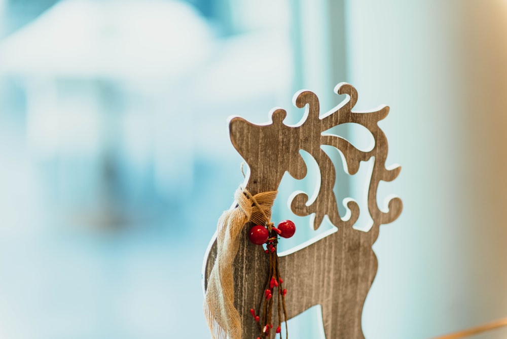 brown wooden carved reindeer decoration on table