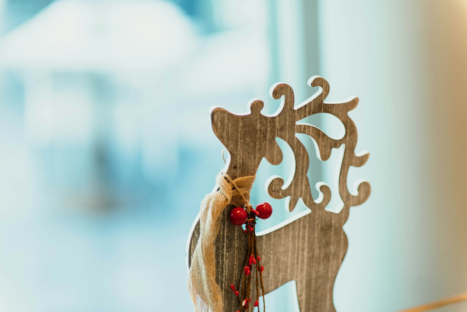 Sigma 85mm F1.4 EX DG HSM sample photo. Brown wooden carved reindeer photography