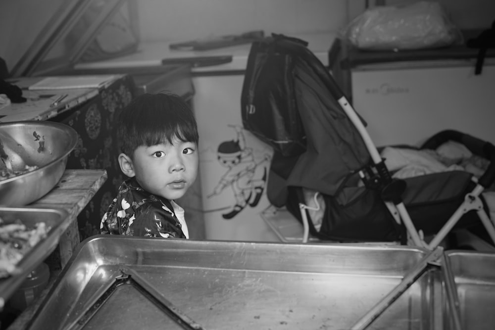 boy sitting in kitchen