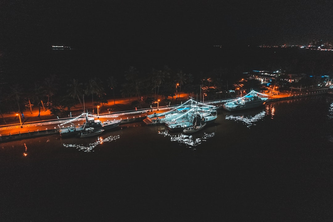 boat with lights during night time