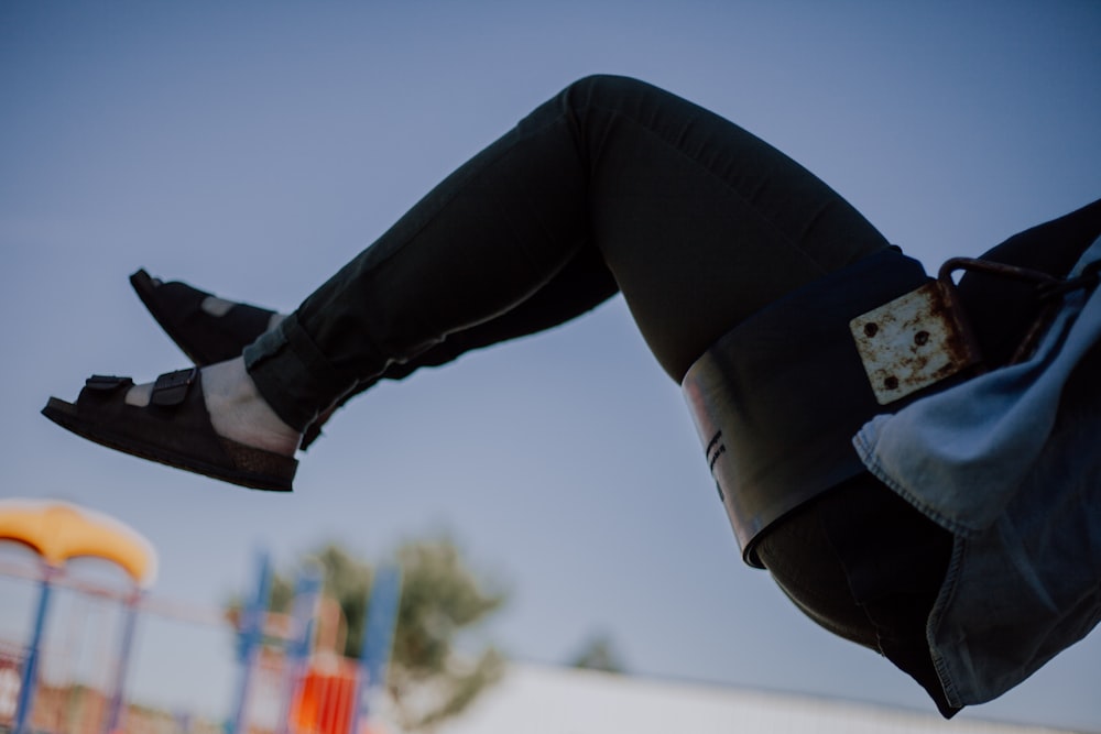 closeup photo of person raising her feet