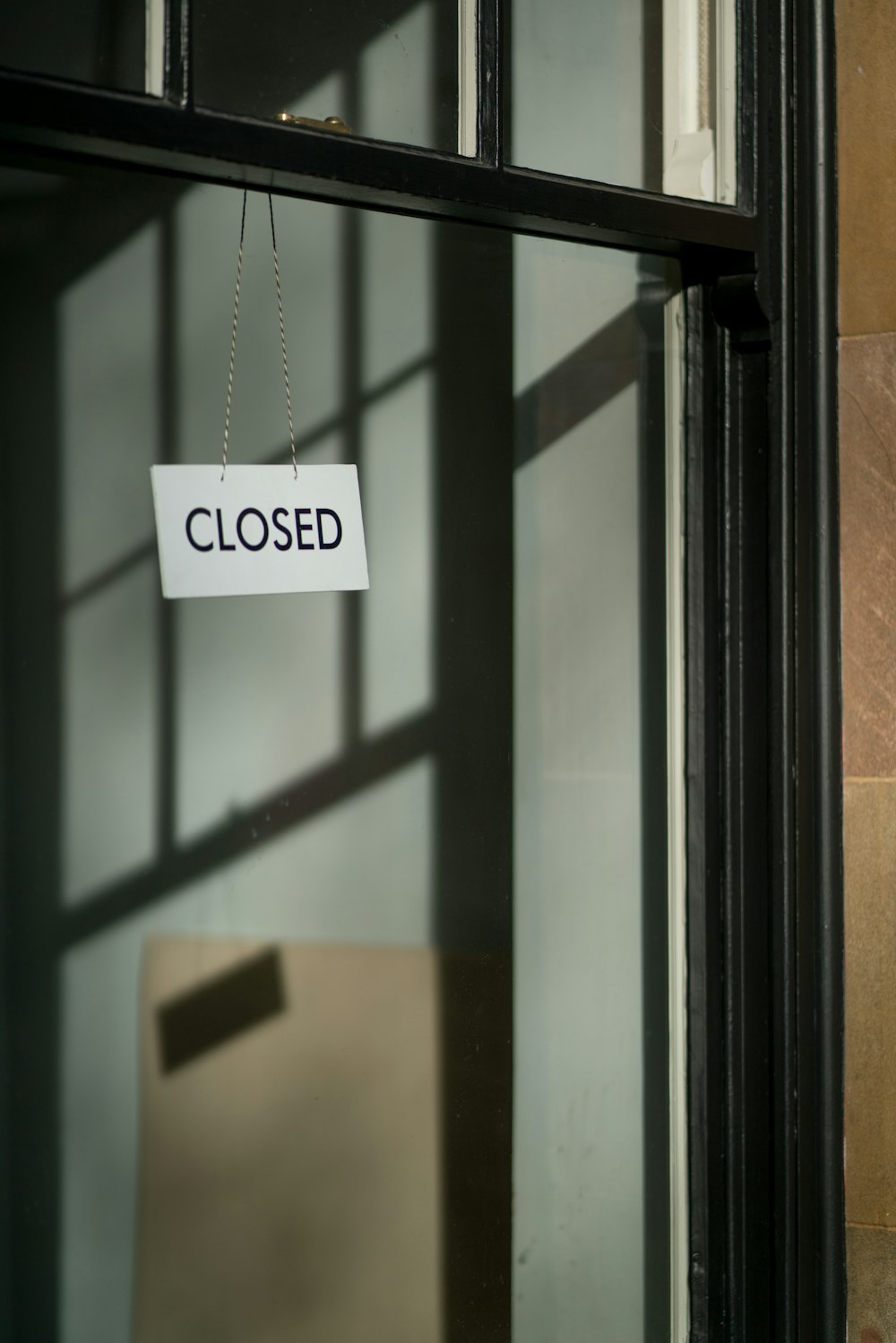 white closed hanging signage