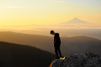 man standing on cliff leisure activity google meet background