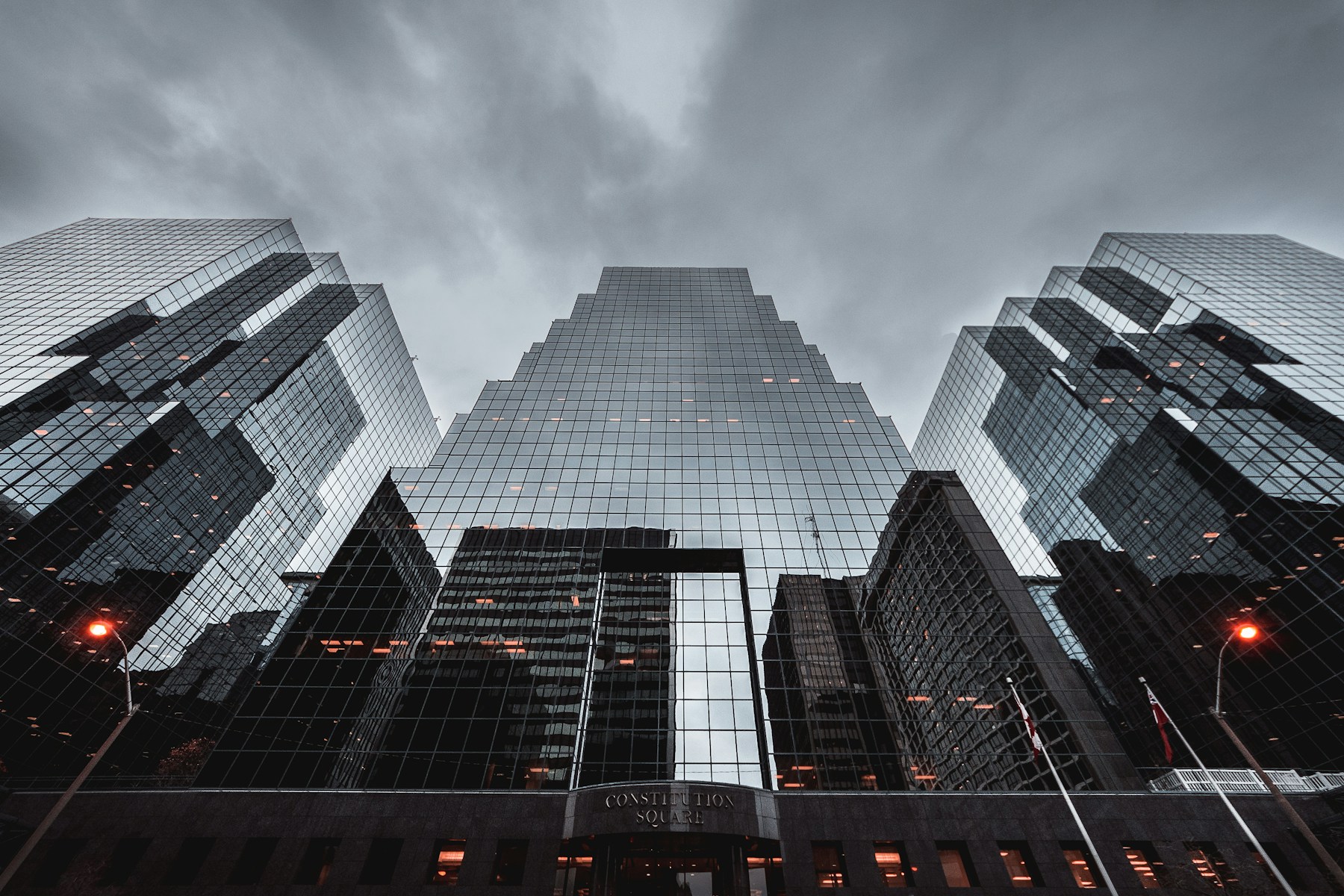 Curved monochrome facade against open sky