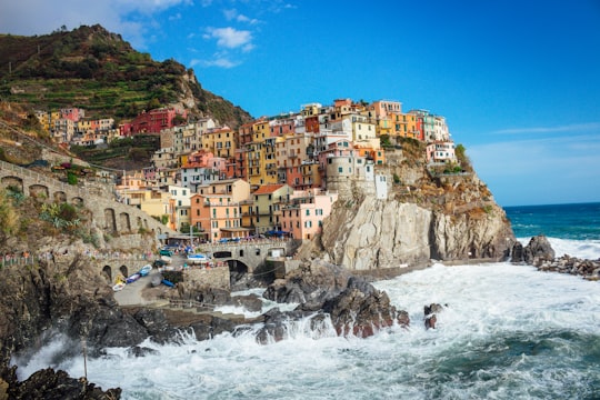 multicolored concrete houses near cliff in Parco Nazionale delle Cinque Terre Italy