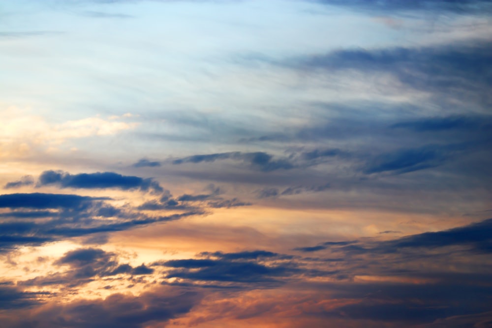 cumulus clouds during golden hour