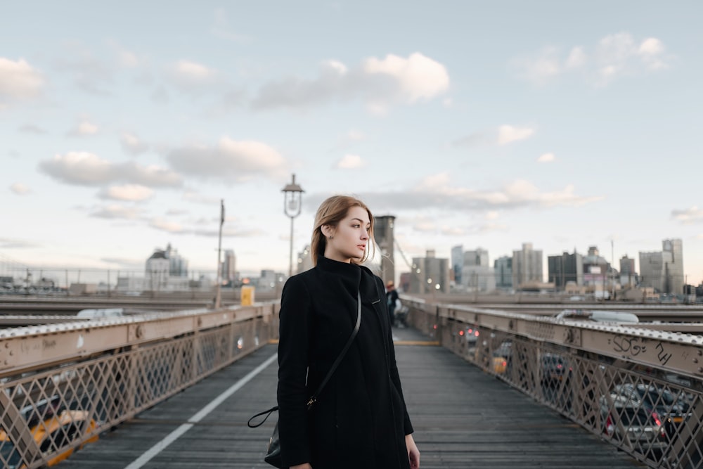woman standing on Brooklyn Bridge