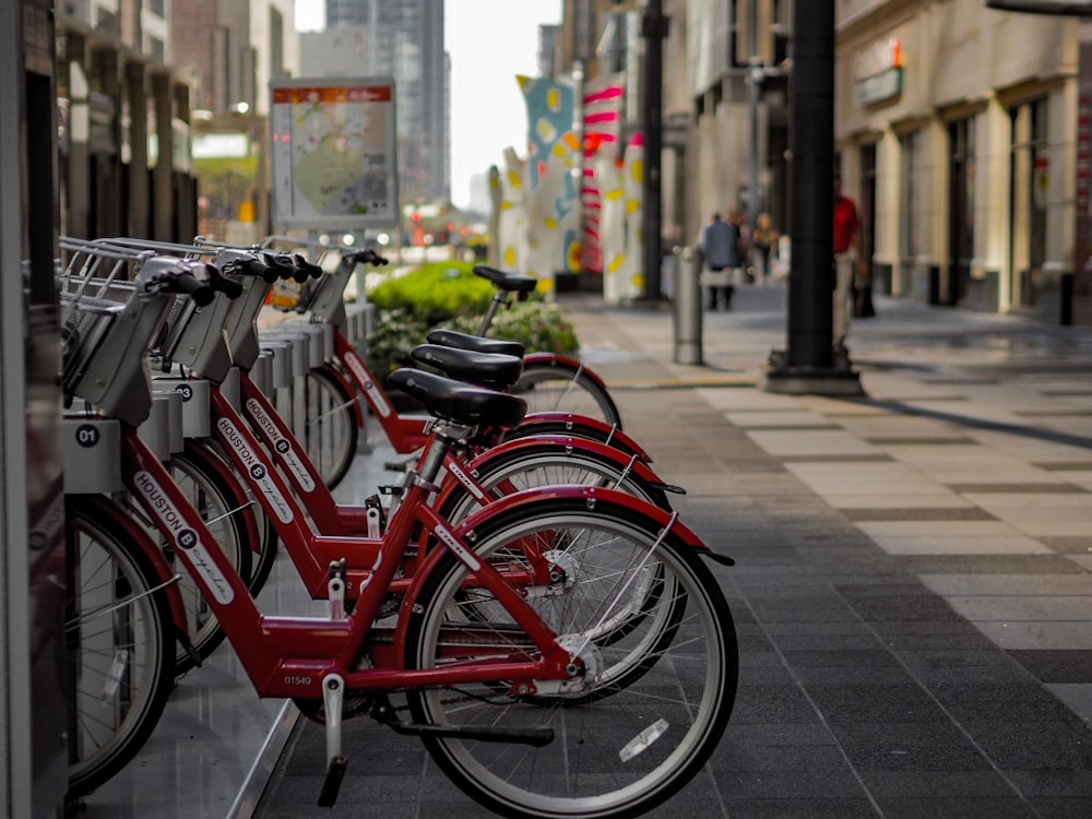 parked red bike near road