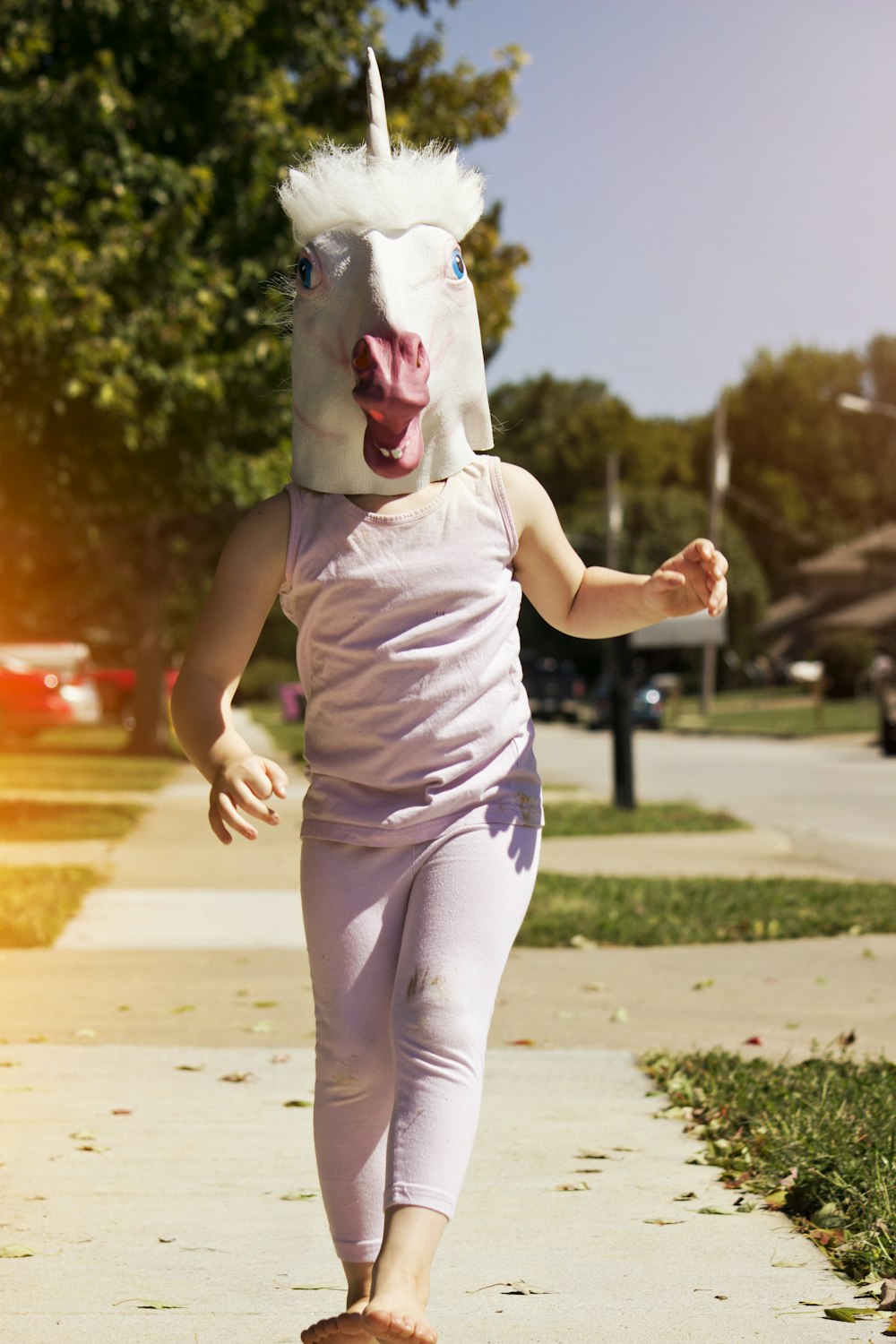 person wearing unicorn hat while walking outside