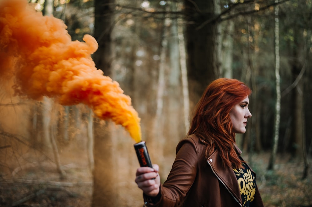 woman holding gas bomb