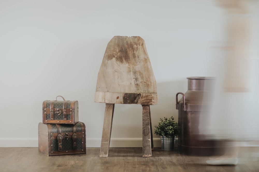 brown wooden table beside two luggage bags