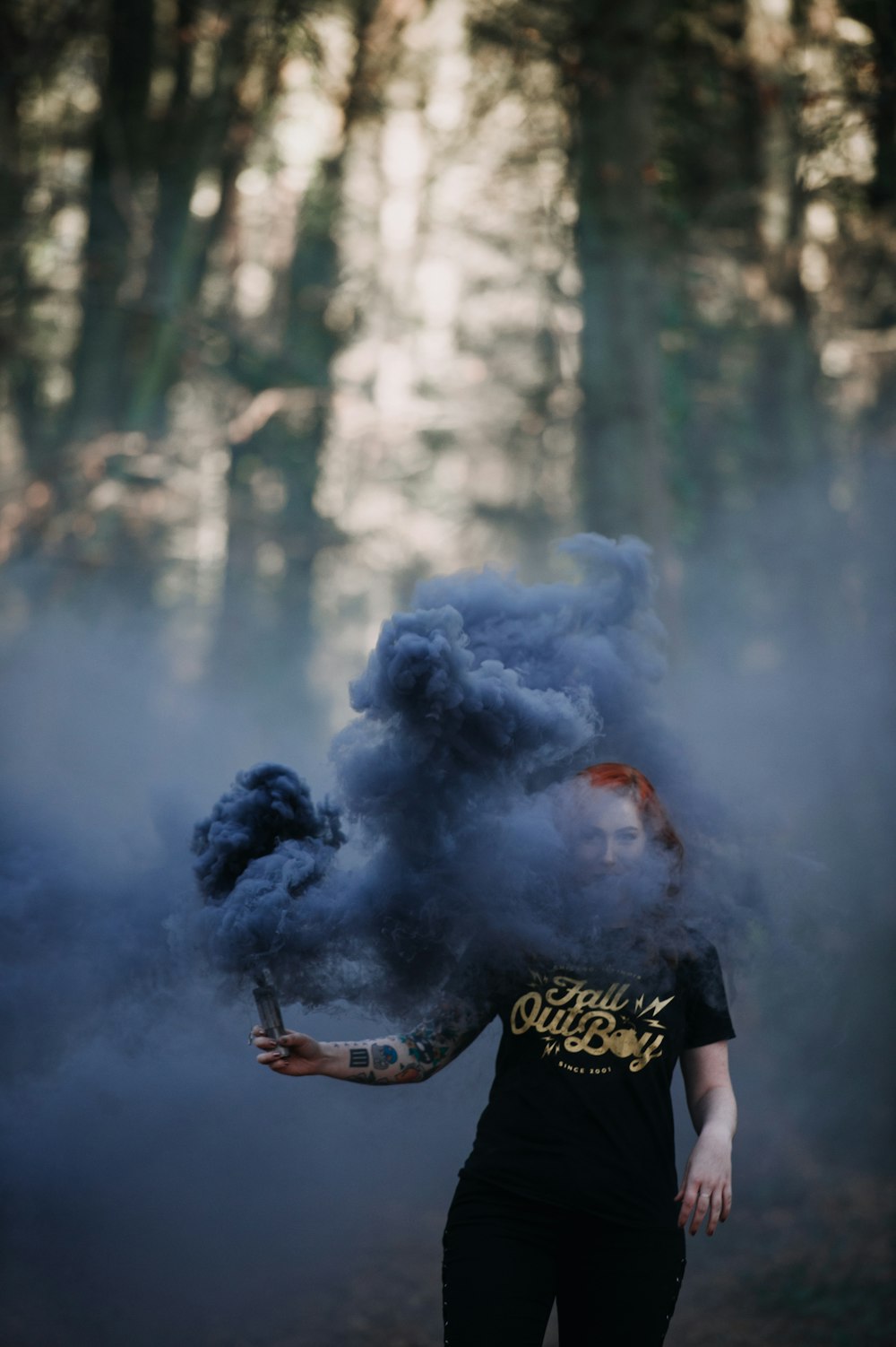 woman holding smoke signal