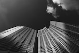 low angle grayscale photography of skyscraper