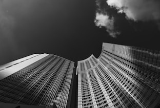 low angle grayscale photography of skyscraper