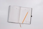 pencil on opened notebook