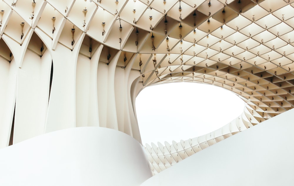 a large white structure with a sky background