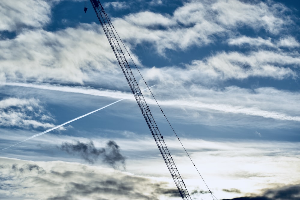 black metal heavy equipment under blue sky