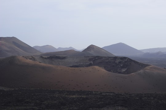 aerial photography of mountain range in Timanfaya National Park Spain