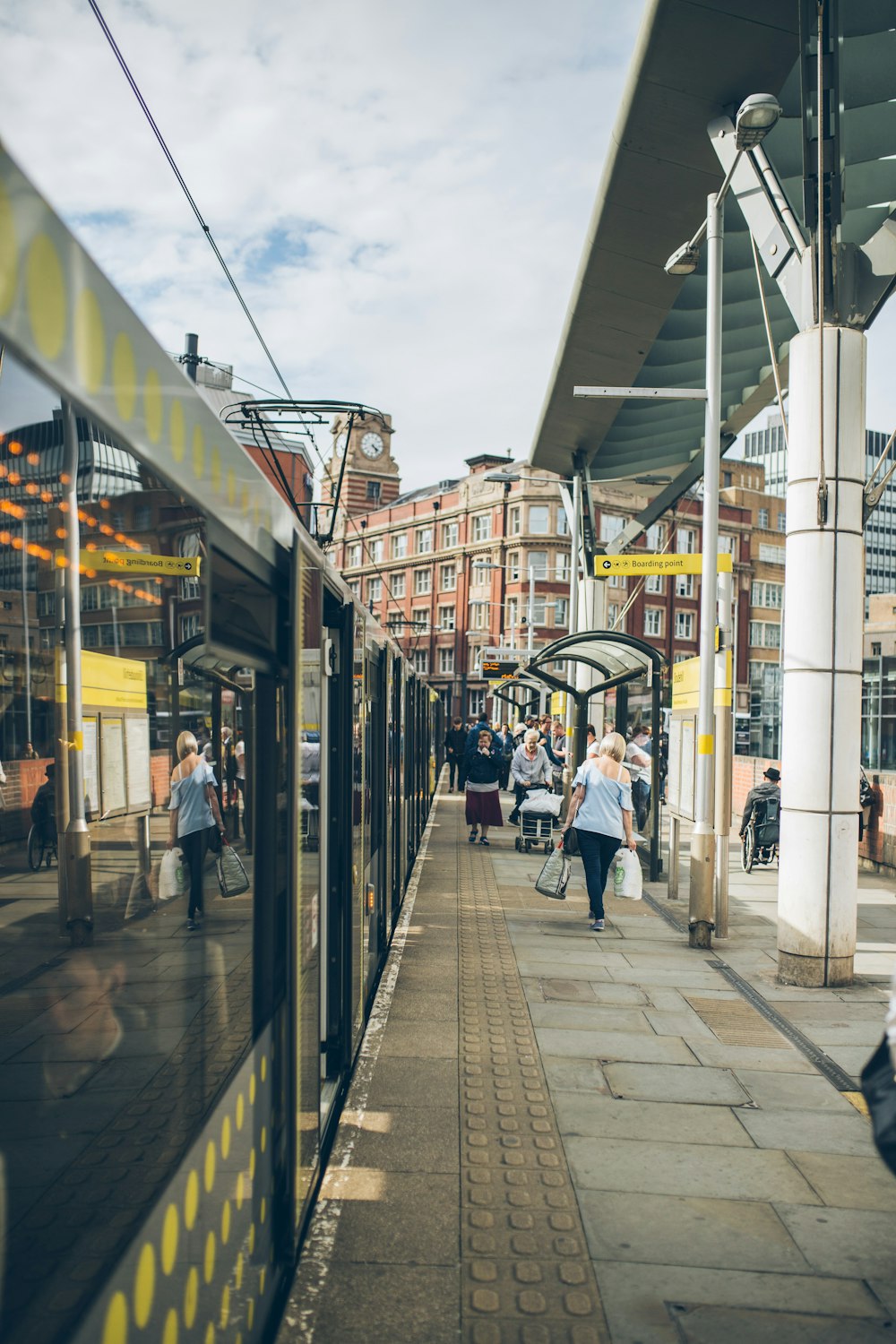 people waling on train station