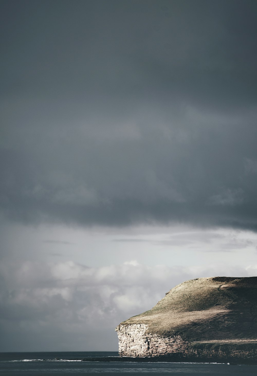 gray rock formation under gray sky