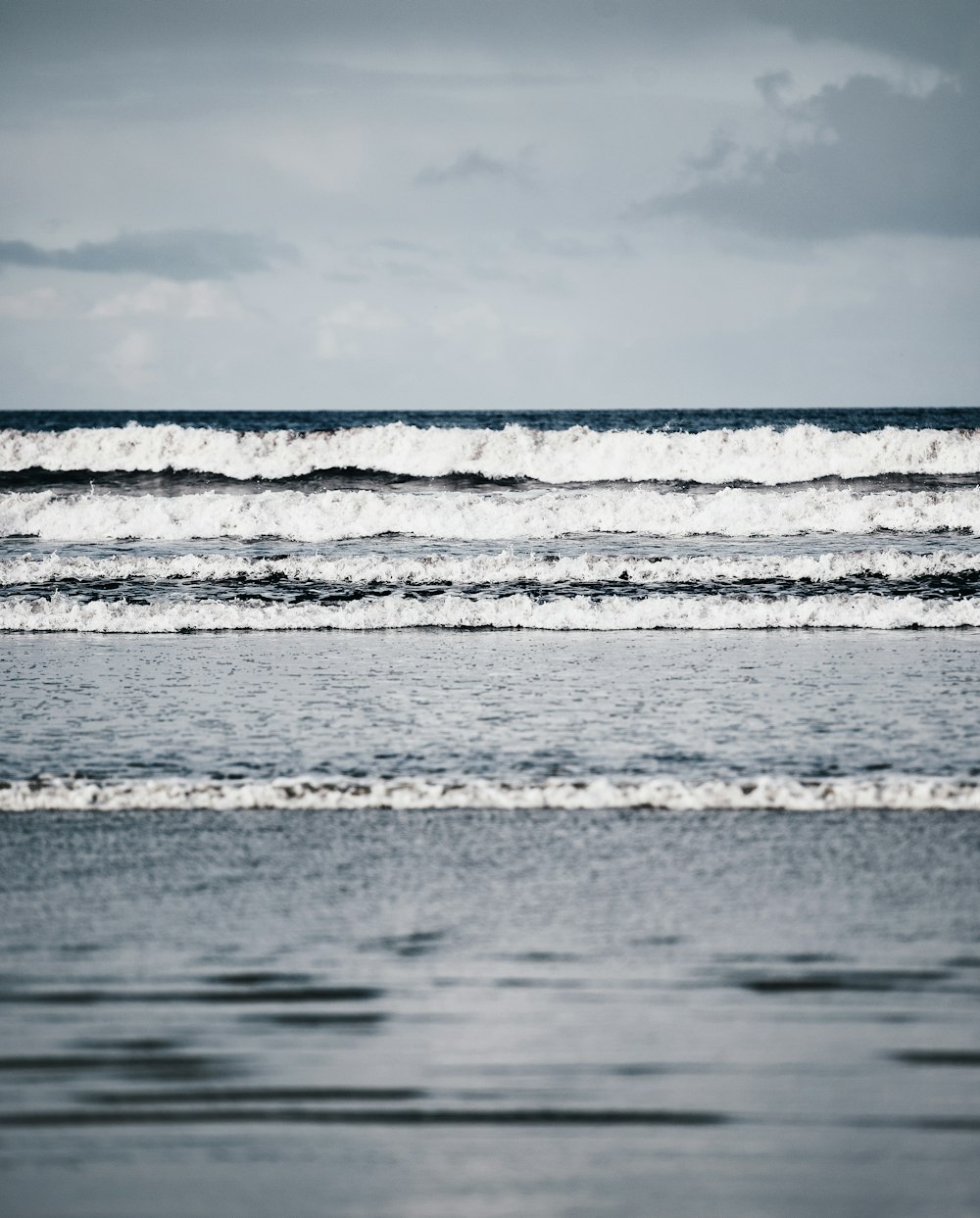 sea water waving towards the shore